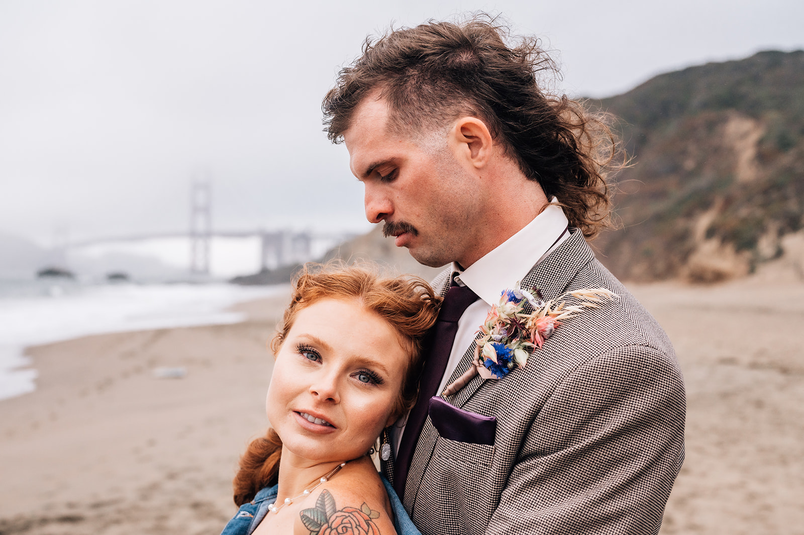 bride and groom on baker beach in san francisco california